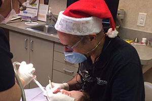 Dr. David Spilkia doing dental surgery in busy times even in holidays